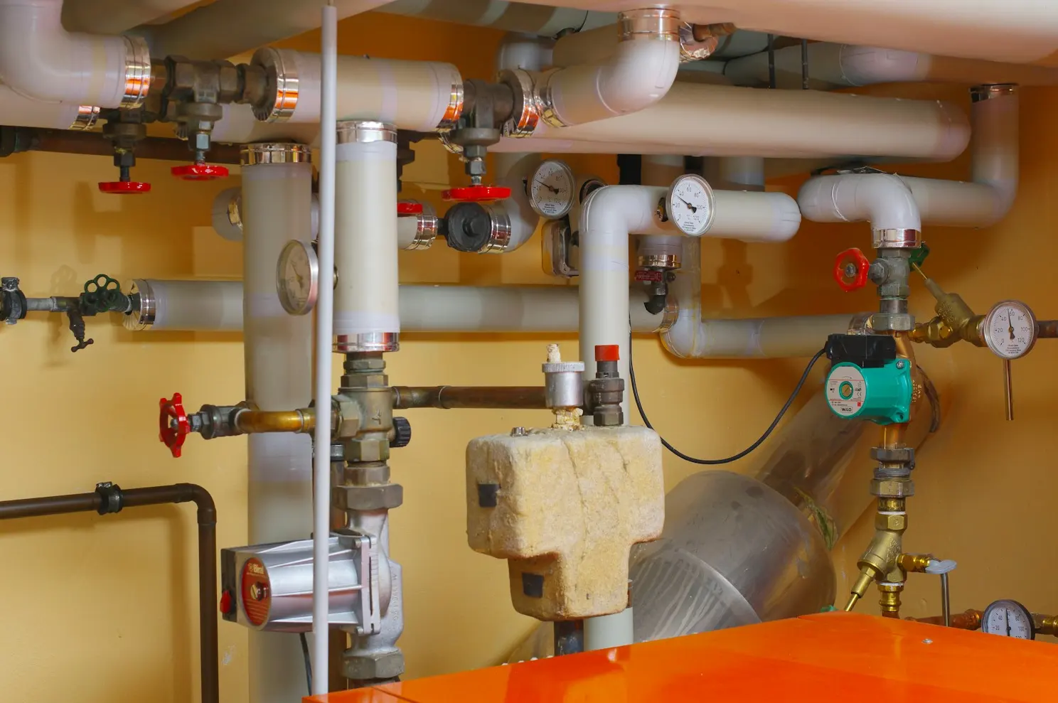 Mechanical room with boiler and heating pipes