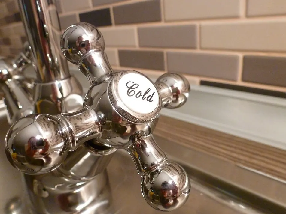 Chrome faucet with running water