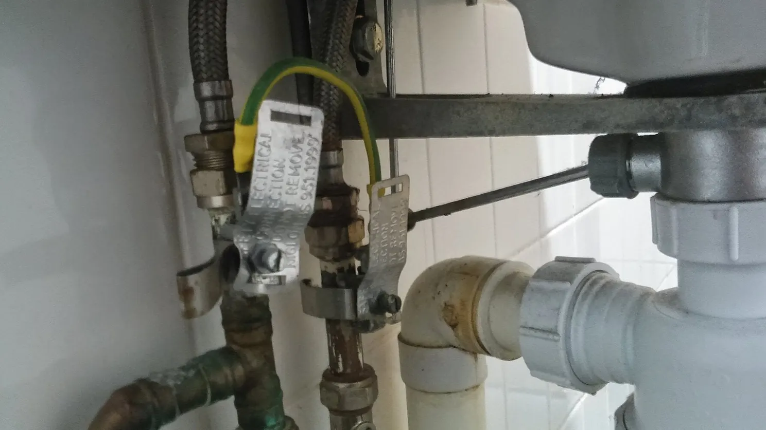 Licensed plumber working on a residential repair